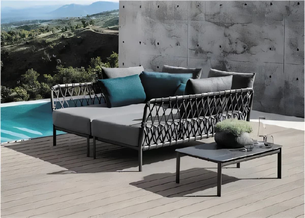 Daybed con respaldo tejido en rombos y almohadones