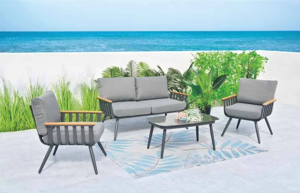 Juego de living de aluminio, mesa de vidrio templado y asientos con almohadones, gris